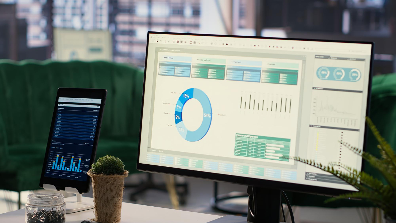 Analytics dashboard on monitor and tablet showing different analytics interfaces