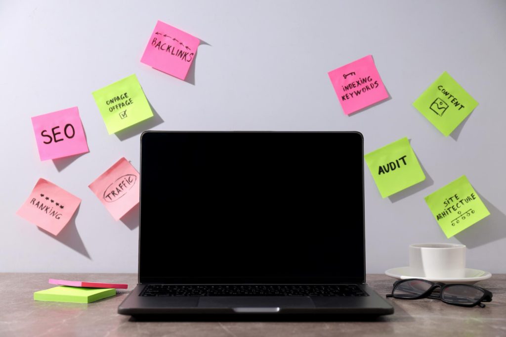 Technical SEO audit checklist with stickers on laptop